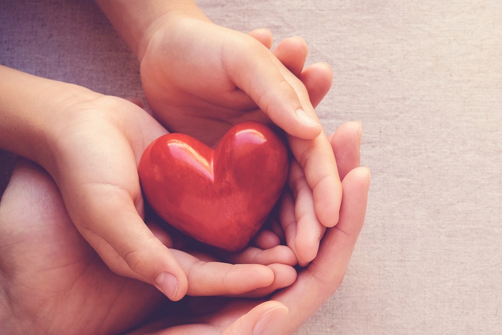 Caring hands with loveheart