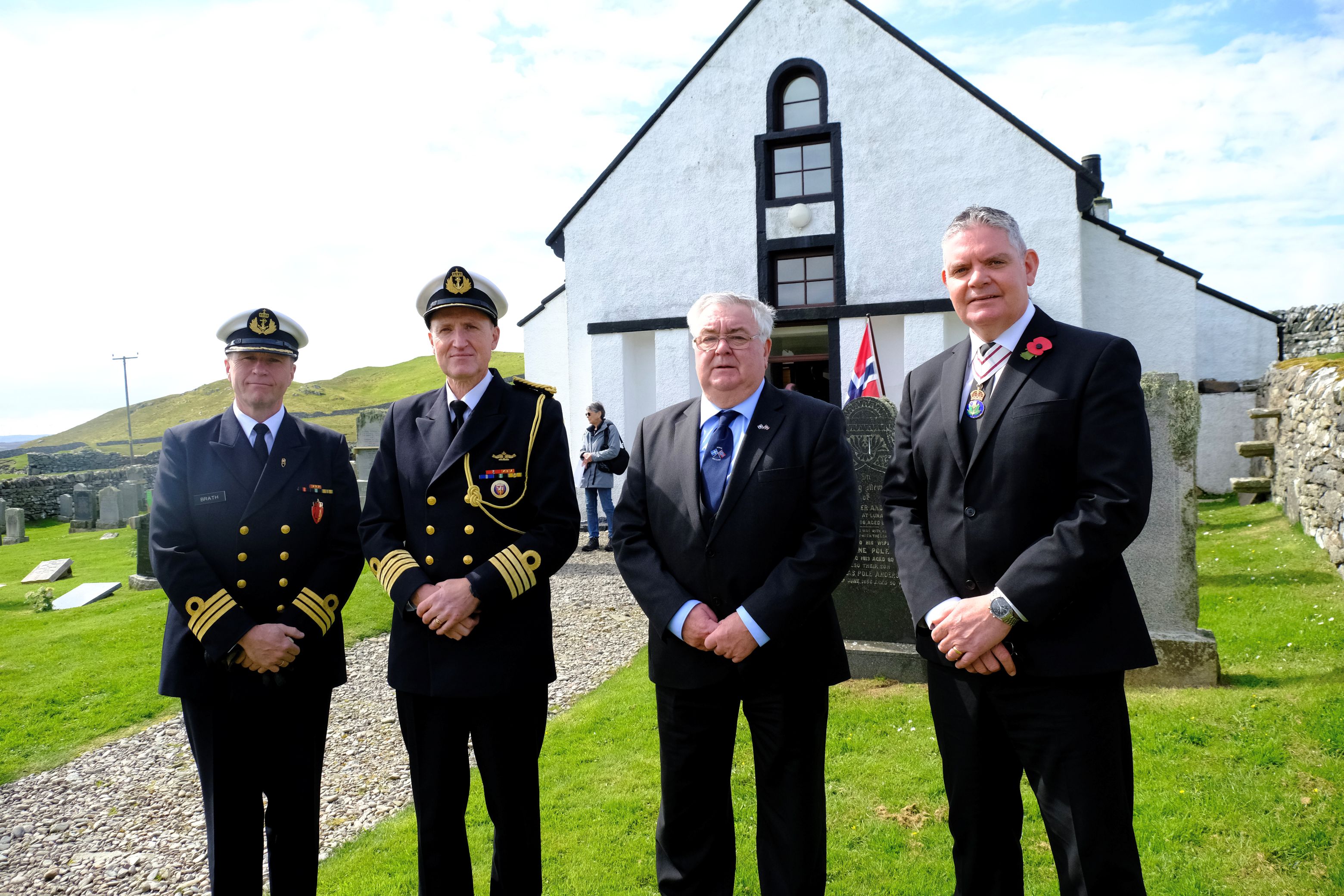 Participants stand outside Lunna Kirk