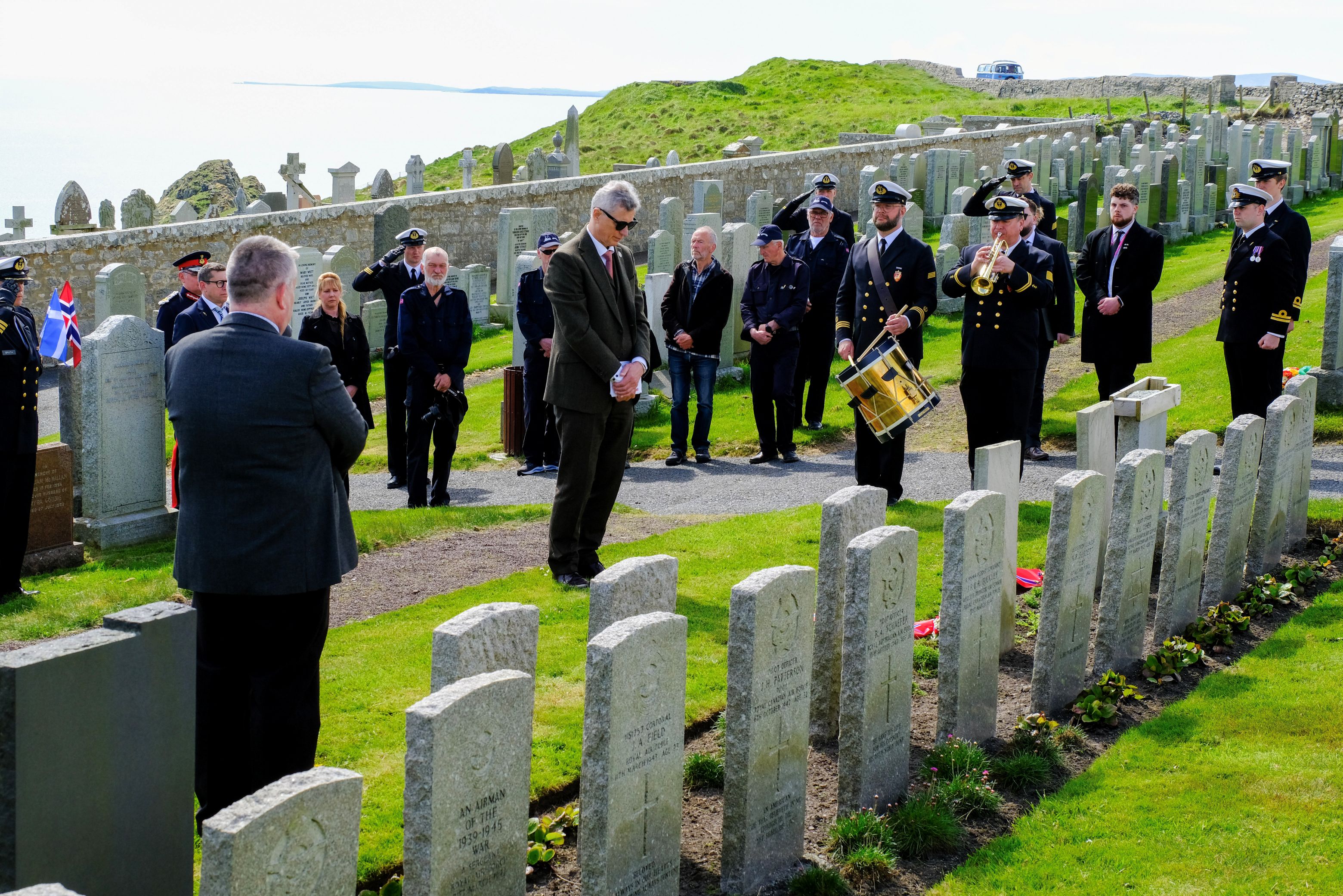 The last post is played at the Knab Cemetary in Lerwick