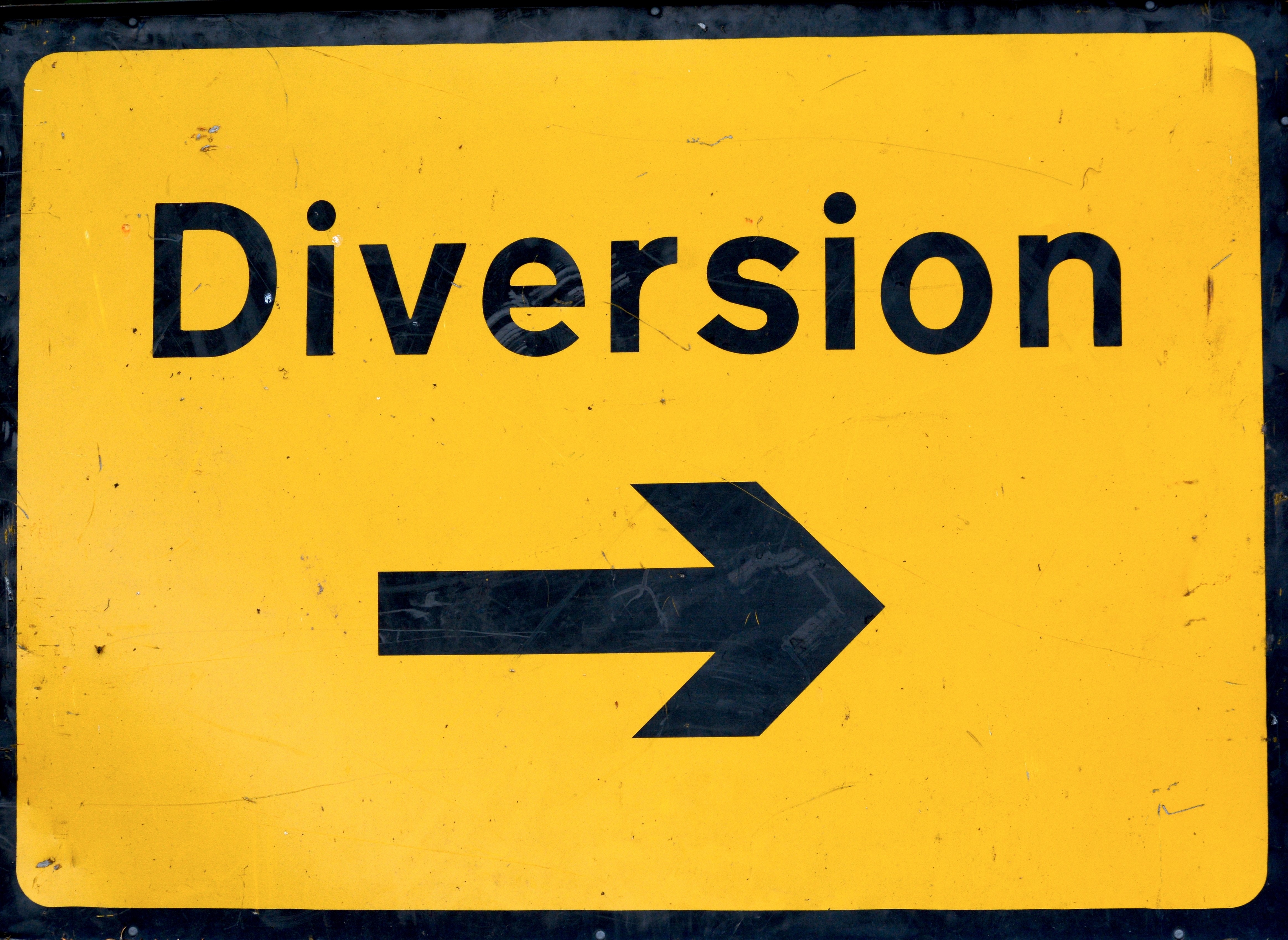 yellow road diversion sign