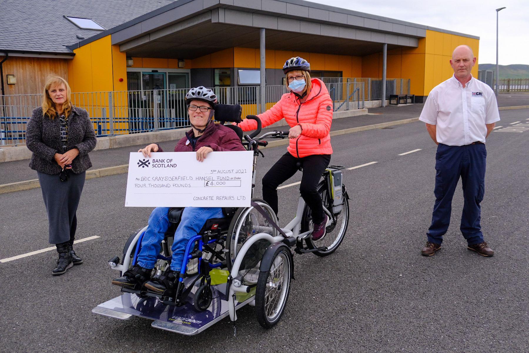 Eric gray cheque donation powered bike sml