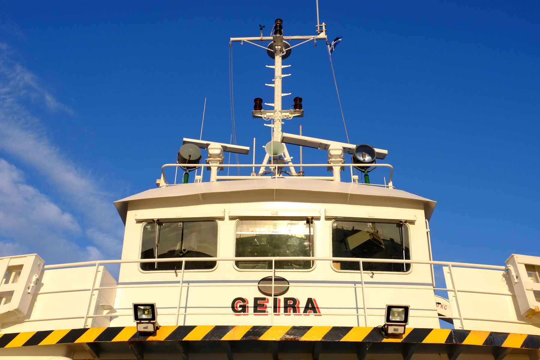The deck of the MV Geira showing the bridge, and the name painted below it.