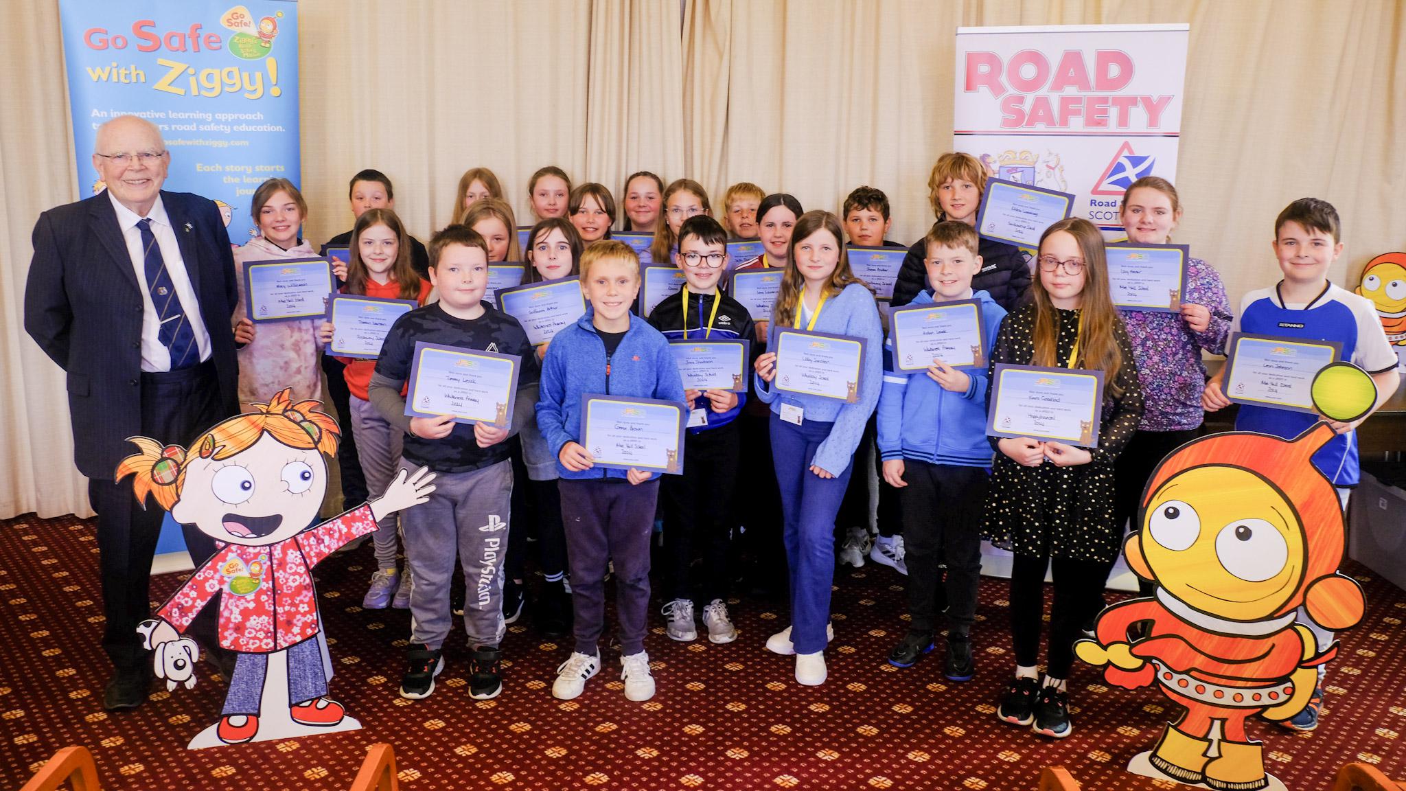 Councillor Robbie McGregor (left) with Junior Road Safety Officers (JRSOs) from the seven Shetland schools who attended today’s presentation at Lerwick Town Hall. Credit: SIC