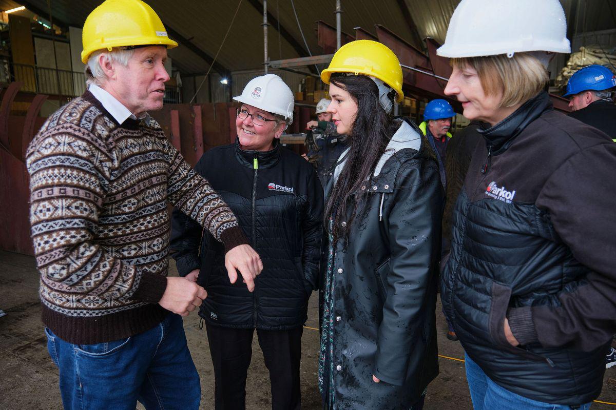 Skipper on the Good Shepherd IV, Ian Best (left) discusses his Fair Isle gansey with Tricia Willis, Procurement and Project Manager, Parkol; Marie Bruhat; and Sally Atkinson, Commercial Director, Parkol