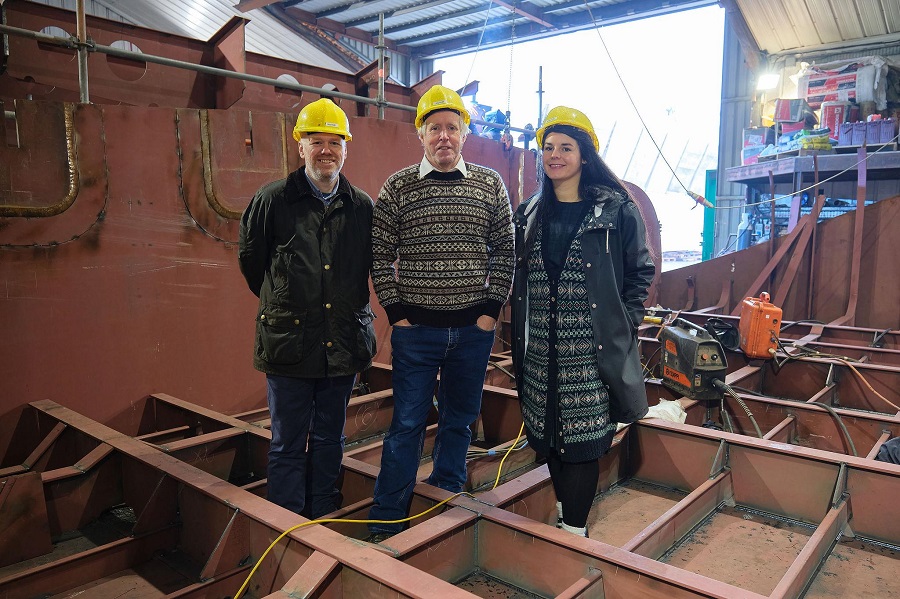 Standing in the first steelwork for the new Fair Isle ferry - (L to R) Project Manager Lee Coutts, and Fair Isle residents, ferry skipper Ian Best and Marie Bruhat.  Credit: SIC/Paul Armstrong