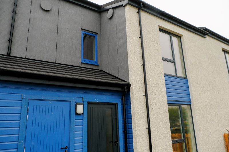 Exterior of north wall showing blue door and finishes