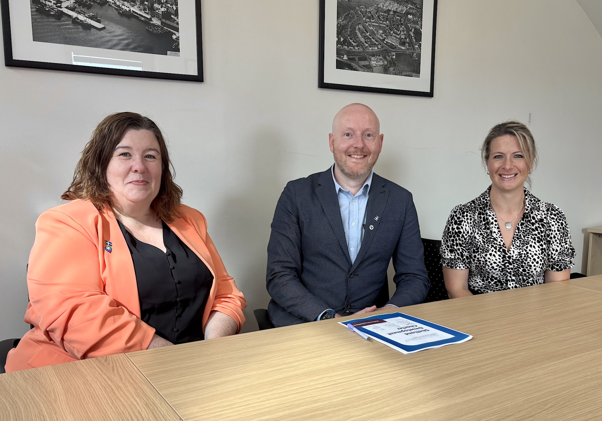 Signing the Shetland Development Charter are Shetland Islands Council Leader Emma Macdonald, Shetland Aerogenerators Development Manager Brendan Hall and Chair of EmPowering Shetland Katrina Wiseman