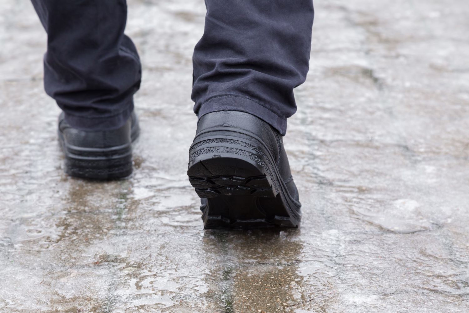 Walking on icy pavement.  Credit: Shutterstock