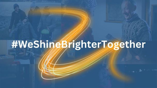 #WeShineBrighterTogether written over a yellow lightening swoosh. The background is blue transparent with images of people in Shetland in the winter.