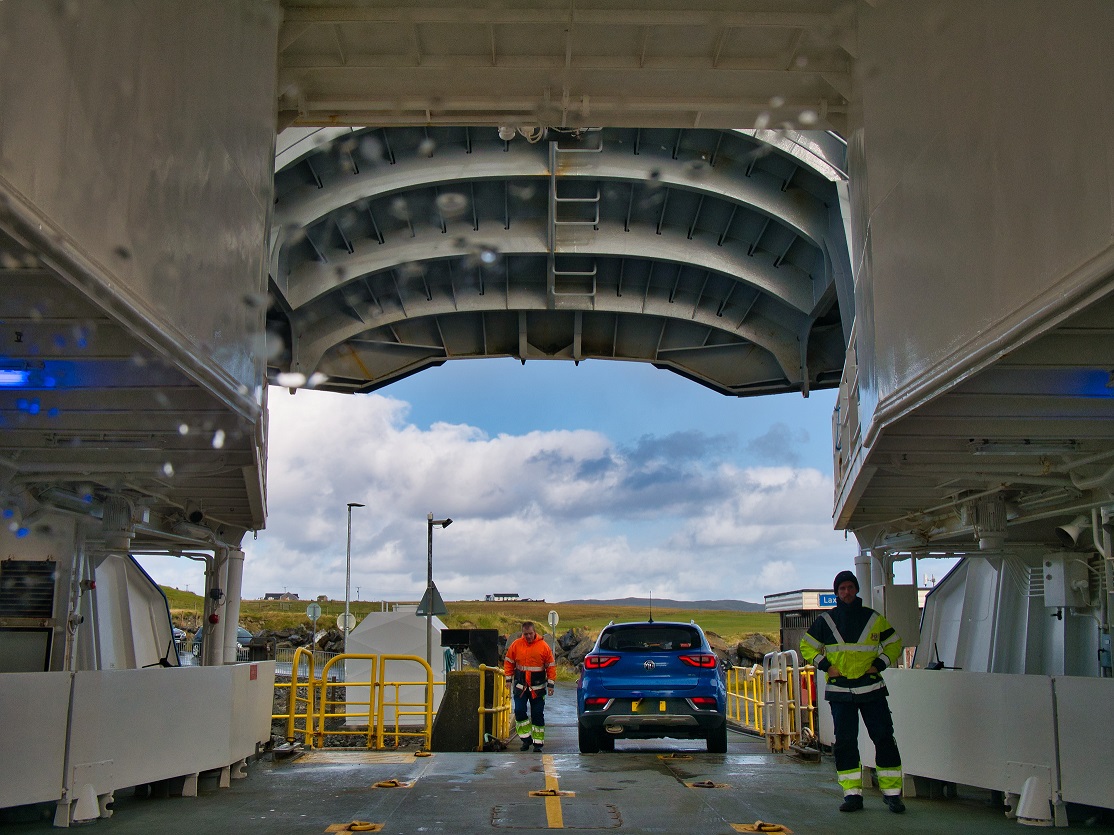 Shetland Islands Ferry deck with ferrymen and leaving car